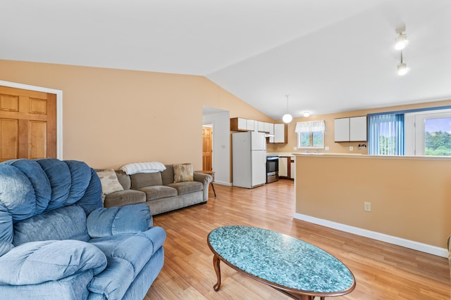 51 Burnham Rd, Saco, ME 04072 - living area featuring light wood-style floors, lofted ceiling, and baseboards