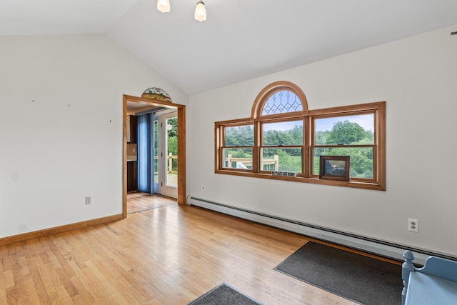 51 Burnham Rd, Saco, ME 04072 - unfurnished room featuring a baseboard heating unit, vaulted ceiling, light wood-type flooring, and baseboards