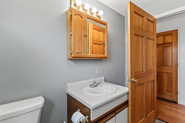 51 Burnham Rd, Saco, ME 04072 - bathroom featuring toilet, vanity, and wood finished floors
