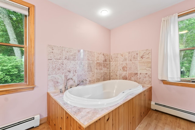 51 Burnham Rd, Saco, ME 04072 - bathroom with a baseboard radiator, wood finished floors, and a garden tub