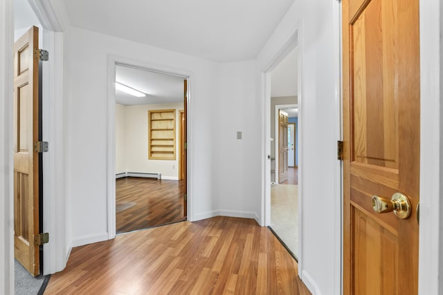 51 Burnham Rd, Saco, ME 04072 - hall with light wood-style flooring, baseboards, and a baseboard heating unit