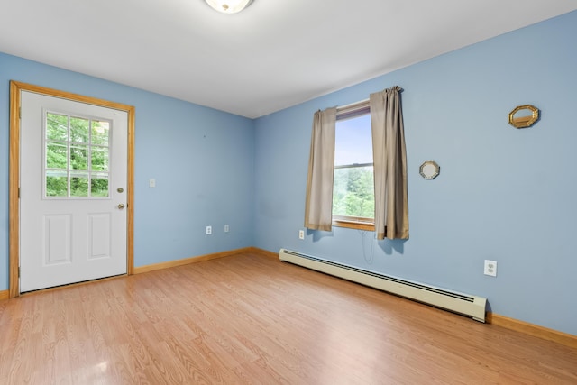 51 Burnham Rd, Saco, ME 04072 - empty room featuring baseboard heating, light wood finished floors, and baseboards