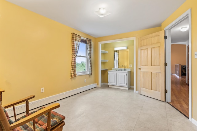51 Burnham Rd, Saco, ME 04072 - unfurnished bedroom featuring a baseboard heating unit, baseboards, and light tile patterned flooring