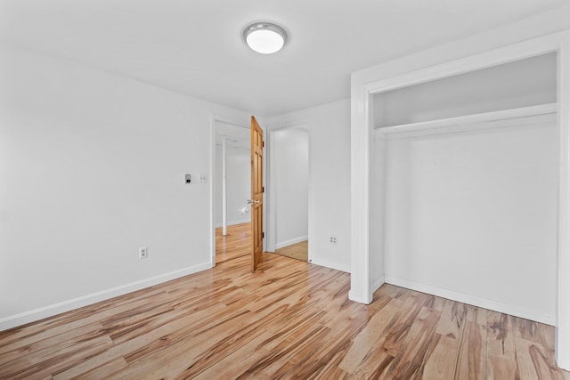 51 Burnham Rd, Saco, ME 04072 - unfurnished bedroom with light wood finished floors, baseboards, and a closet