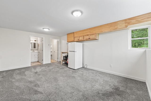 51 Burnham Rd, Saco, ME 04072 - unfurnished bedroom featuring freestanding refrigerator, baseboards, light colored carpet, and ensuite bathroom