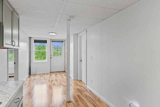 51 Burnham Rd, Saco, ME 04072 - doorway to outside with a drop ceiling, light wood finished floors, baseboards, and a baseboard radiator