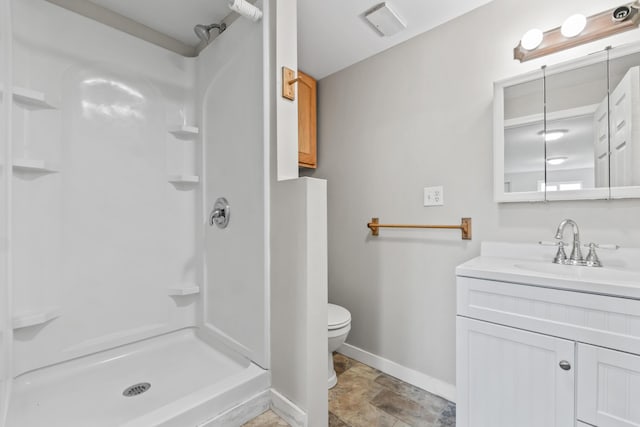 51 Burnham Rd, Saco, ME 04072 - bathroom featuring baseboards, a shower, vanity, and toilet