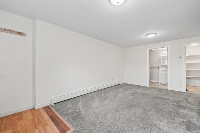 51 Burnham Rd, Saco, ME 04072 - unfurnished bedroom with a baseboard radiator, a spacious closet, ensuite bathroom, and baseboards