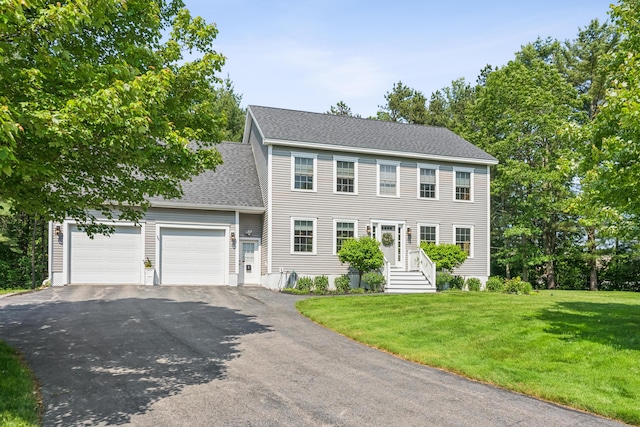 3 Bradfield Way, Kennebunk, ME 04043 - colonial home featuring driveway, an attached garage, a front yard, and roof with shingles