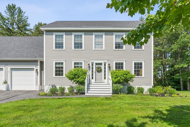 3 Bradfield Way, Kennebunk, ME 04043 - colonial inspired home featuring asphalt driveway, a front yard, a garage, and roof with shingles