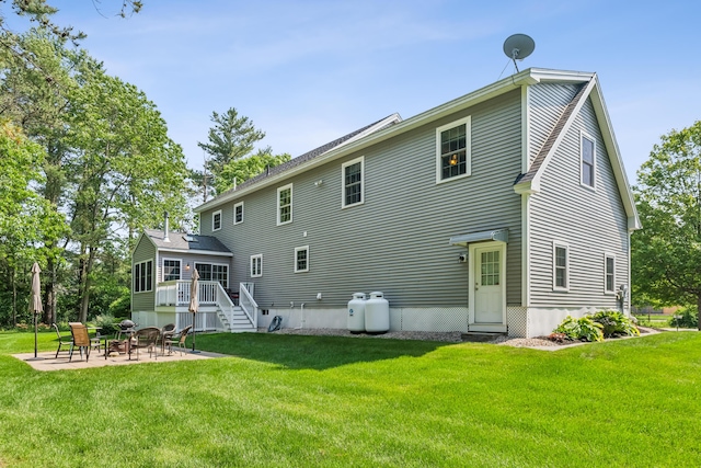 3 Bradfield Way, Kennebunk, ME 04043 - rear view of house featuring a patio area, a lawn, and a fire pit