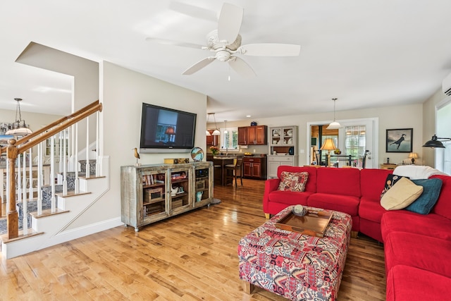 3 Bradfield Way, Kennebunk, ME 04043 - living area featuring light wood finished floors, a ceiling fan, and stairs