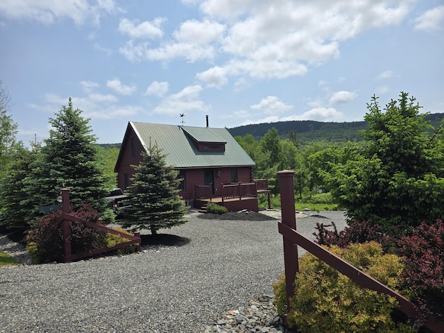 224 Maynard Rd Unit T1 R1, Nbkp, ME 04478 - view of property exterior featuring a deck and a metal roof