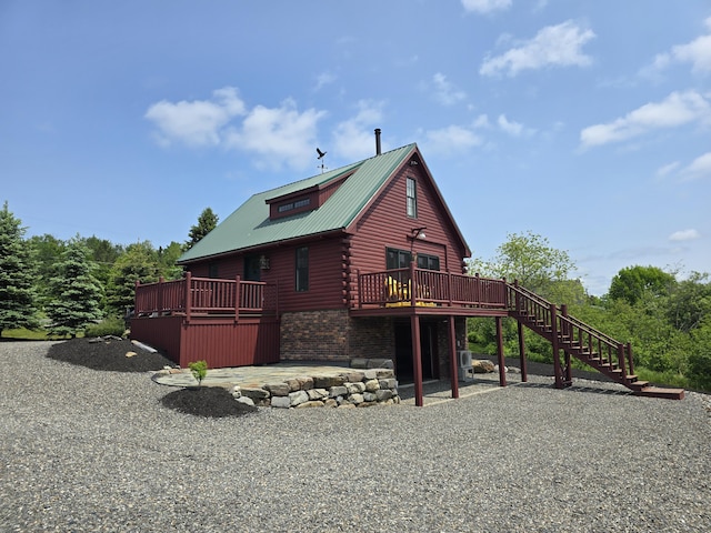 224 Maynard Rd Unit T1 R1, Nbkp, ME 04478 - view of property exterior with a wooden deck, stairs, a metal roof, and log siding