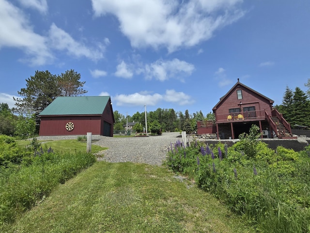 224 Maynard Rd Unit T1 R1, Nbkp, ME 04478 - view of green lawn featuring an outbuilding and a wooden deck