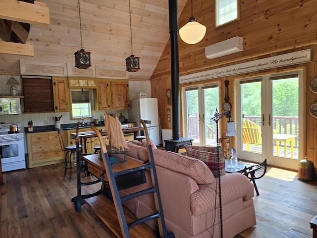 224 Maynard Rd Unit T1 R1, Nbkp, ME 04478 - living room featuring wooden walls, high vaulted ceiling, a wall unit AC, dark wood-style floors, and french doors