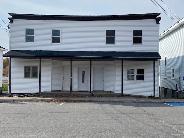 6 Main St, Howland, ME 04448 - view of front of property with a porch and roof with shingles