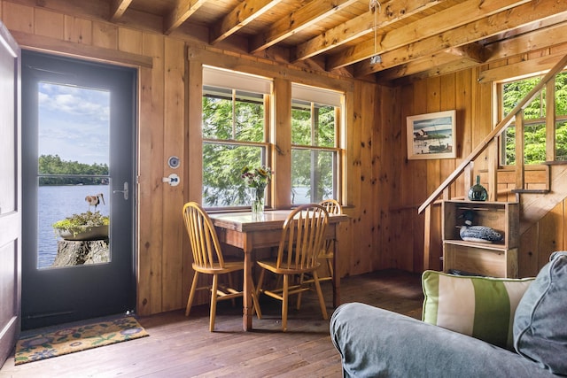 36 Cove Ln, Damariscotta, ME 04543 - dining room featuring wood ceiling with exposed beams, wooden walls, hardwood / wood-style floors, and a water view
