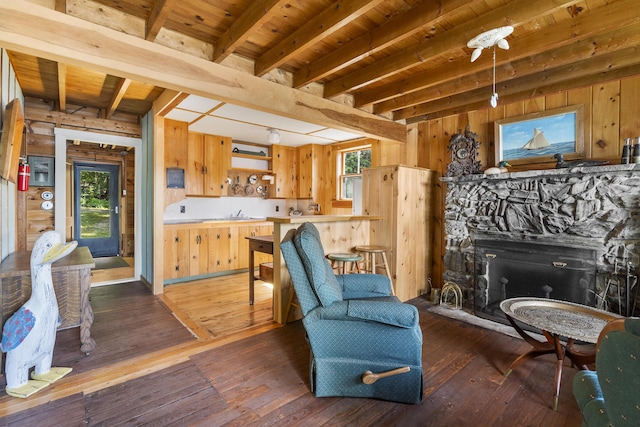 36 Cove Ln, Damariscotta, ME 04543 - living room featuring wood ceiling with exposed beams, wood walls, plenty of natural light, and hardwood / wood-style floors