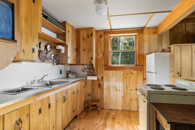36 Cove Ln, Damariscotta, ME 04543 - kitchen with white appliances, light wood finished floors, light countertops, open shelves, and a sink
