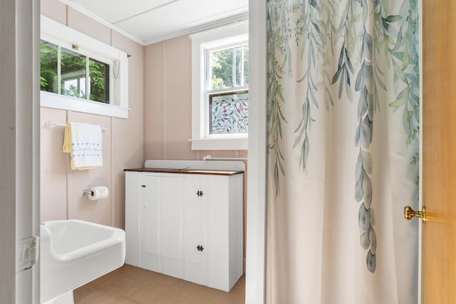 36 Cove Ln, Damariscotta, ME 04543 - bathroom featuring plenty of natural light, a shower with curtain, and crown molding