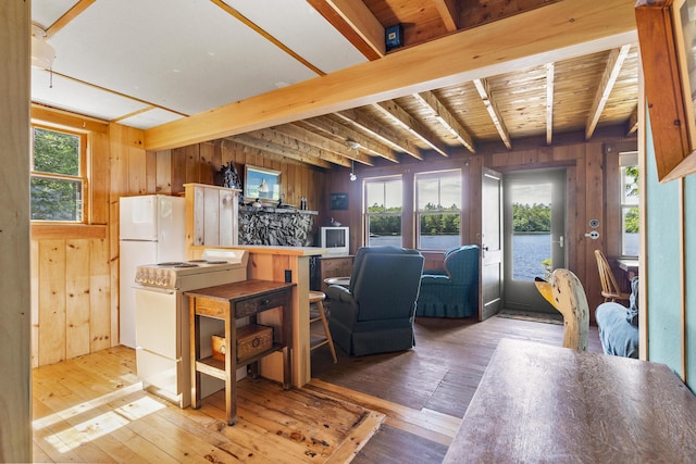 36 Cove Ln, Damariscotta, ME 04543 - living room with wooden walls, beam ceiling, and hardwood / wood-style floors