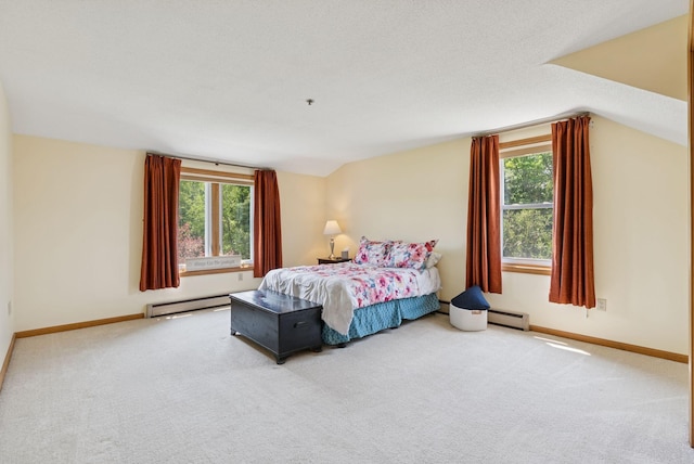 44 Meadowbrook Dr Unit 4, Gorham, ME 04038 - bedroom with multiple windows, baseboard heating, carpet floors, vaulted ceiling, and baseboards