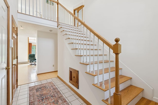 44 Meadowbrook Dr Unit 4, Gorham, ME 04038 - stairway with baseboards and tile patterned floors