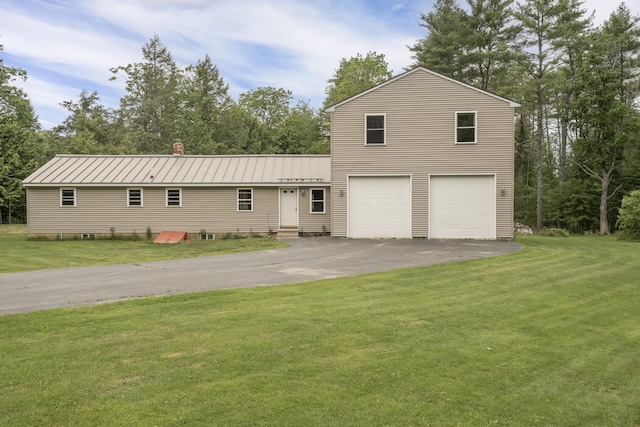 31 W Bay Bridge Rd, Topsham, ME 04086 - view of front of property with driveway, an attached garage, a front lawn, a metal roof, and entry steps