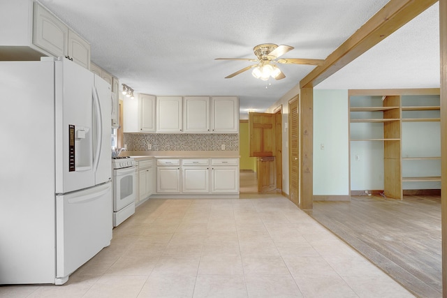 31 W Bay Bridge Rd, Topsham, ME 04086 - kitchen with white appliances, a ceiling fan, light countertops, backsplash, and a textured ceiling
