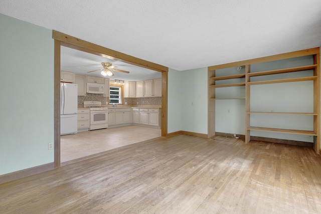 31 W Bay Bridge Rd, Topsham, ME 04086 - unfurnished living room featuring light wood-style floors and ceiling fan