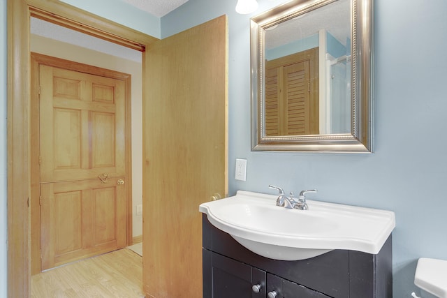 31 W Bay Bridge Rd, Topsham, ME 04086 - bathroom featuring vanity and wood finished floors