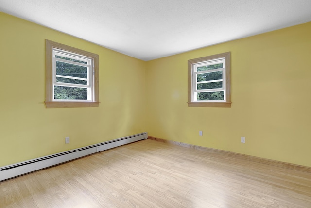31 W Bay Bridge Rd, Topsham, ME 04086 - spare room with a baseboard radiator and wood finished floors