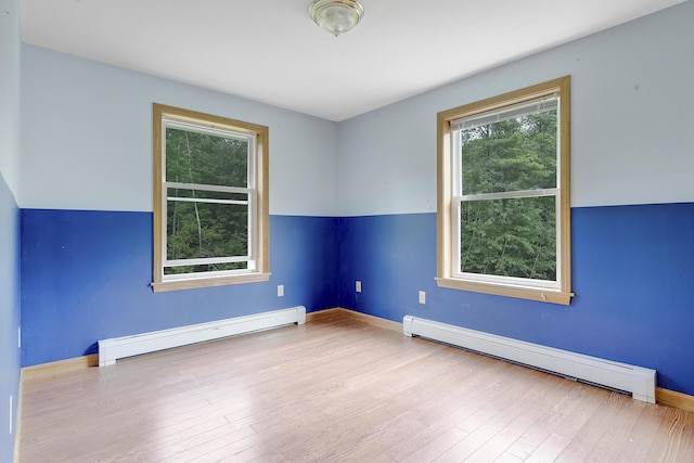 31 W Bay Bridge Rd, Topsham, ME 04086 - unfurnished room featuring baseboard heating, plenty of natural light, and wood finished floors