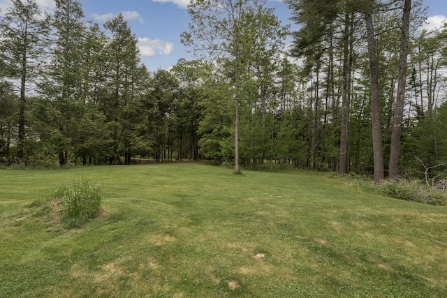 31 W Bay Bridge Rd, Topsham, ME 04086 - view of grassy yard featuring a wooded view