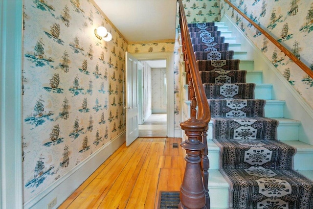 1835 Main St, Fayette, ME 04349 - stairway with wallpapered walls and wood-type flooring