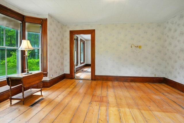 1835 Main St, Fayette, ME 04349 - empty room featuring light wood-type flooring and ornamental molding