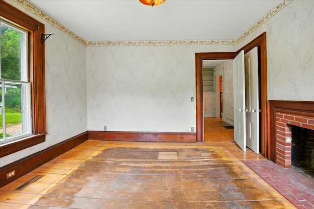 1835 Main St, Fayette, ME 04349 - unfurnished room featuring hardwood / wood-style floors and a brick fireplace
