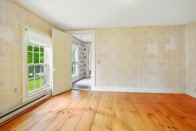 1835 Main St, Fayette, ME 04349 - spare room featuring baseboard heating, hardwood / wood-style floors, and wallpapered walls