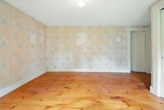 1835 Main St, Fayette, ME 04349 - spare room with wood finished floors and wallpapered walls