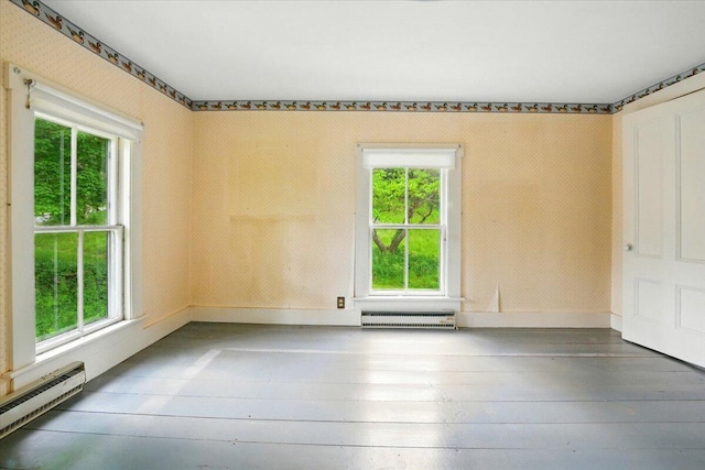 1835 Main St, Fayette, ME 04349 - unfurnished room featuring a baseboard radiator, plenty of natural light, wood-type flooring, and a baseboard heating unit