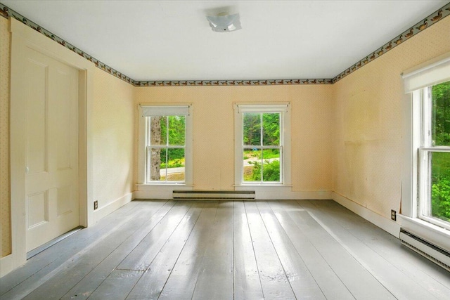 1835 Main St, Fayette, ME 04349 - spare room featuring baseboard heating, plenty of natural light, and wood-type flooring