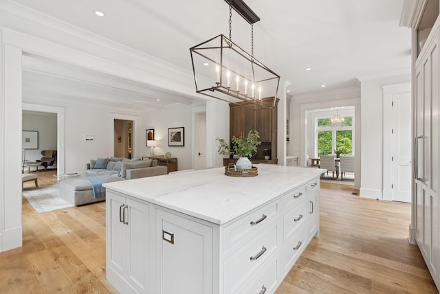 38 Fieldstone Ln, Falmouth, ME 04105 - kitchen featuring a chandelier, a kitchen island, recessed lighting, light wood-type flooring, and light stone countertops