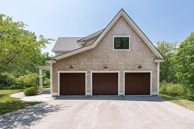 38 Fieldstone Ln, Falmouth, ME 04105 - view of property exterior featuring driveway and a shingled roof