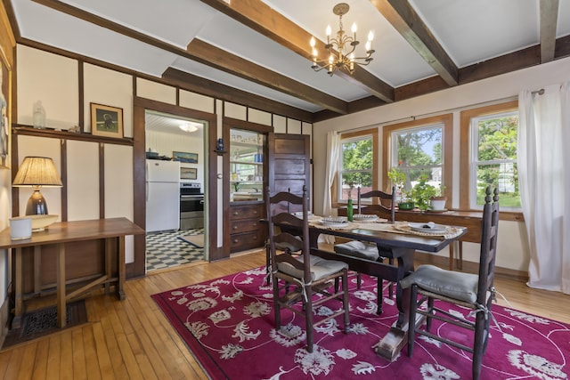 4 Hamlin Pl, York, ME 03909 - dining space featuring a chandelier, beamed ceiling, and light wood-type flooring