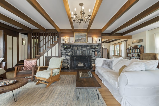 4 Hamlin Pl, York, ME 03909 - living room with beam ceiling, a chandelier, wood finished floors, a fireplace, and stairs