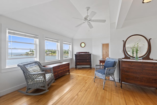 4 Hamlin Pl, York, ME 03909 - living area with lofted ceiling, light wood-style floors, a ceiling fan, baseboards, and a water view