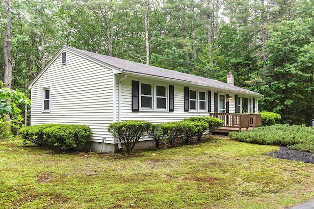 70 Whitten Rd, Kennebunk, ME 04043 - ranch-style home with a front lawn and a chimney
