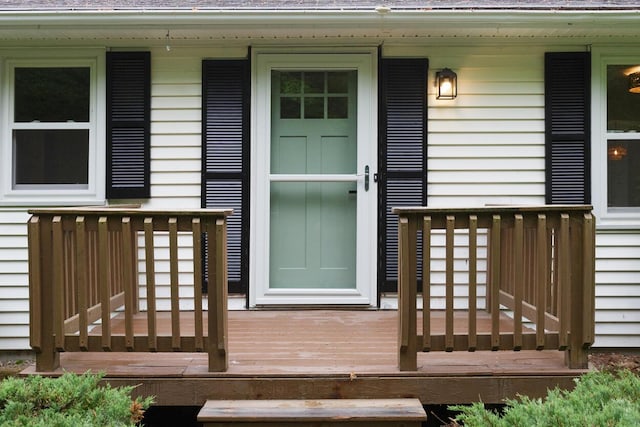 70 Whitten Rd, Kennebunk, ME 04043 - view of exterior entry featuring a shingled roof, covered porch, and a wooden deck