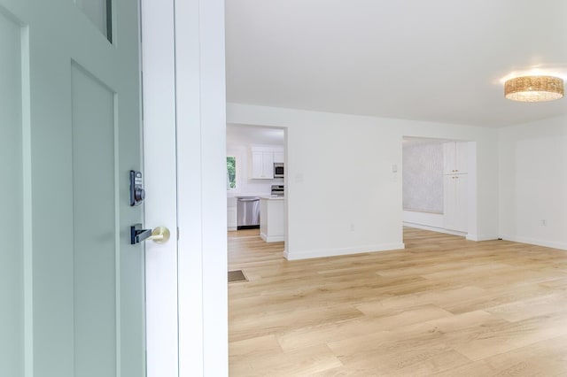 70 Whitten Rd, Kennebunk, ME 04043 - empty room featuring light wood-type flooring and baseboards